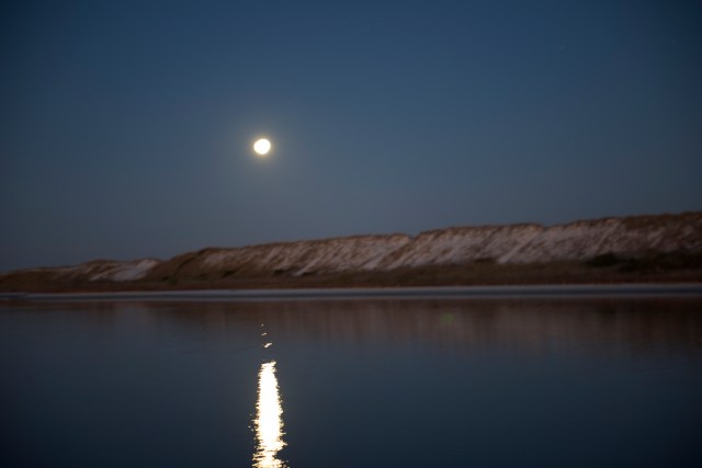 The moon sets over the spoil island on the east end of Big Lagoon.