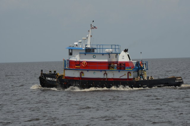 Workboats also travel across the big lake.