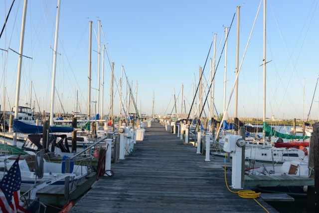 Slanted light from the rising sun illuminates the sailing masts at Rebel Marina.  We know that we are in serious cruising waters.