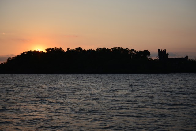 The setting sun silhouettes Bannerman's Castle.