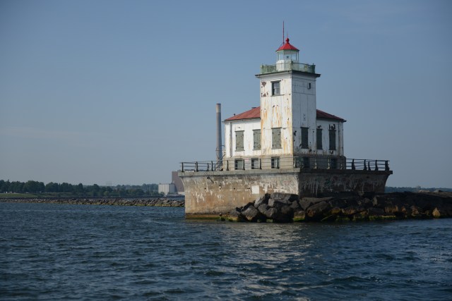 The lighthouse at the port of Oswego guides mariners into the channel as they approach from Lake Ontario. 