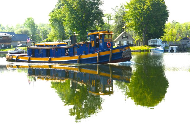The Urger as she passes Winter Harbor Marina in Brewerton, NY.