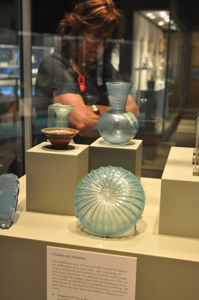 Suzanne studying an exhibit at the Corning Museum of Glass.