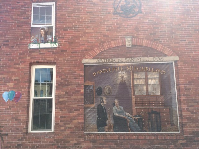 There is a story behind each mural. Note the dentist's chair & equipment.