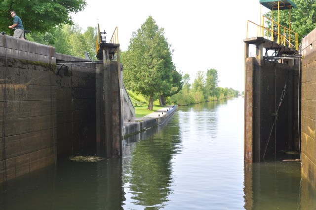 The lock is opening as we prepare to exit.  This lock lowered us on the Severn River as it makes its way to Georgian Bay, the northeast section of Lake Huron.  Note the young man operating the mechanism that opens the heavy lock gates.