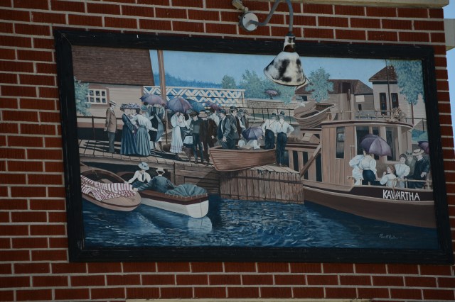 A wall mural at a building alongside a lock.