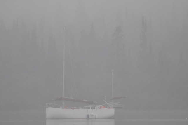 Sailboat anchored in the fog at Michipicoten Island, Lake Superior