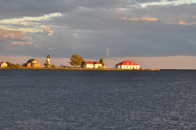 After the storm, the setting sun highlights the cape on Beaver Island.