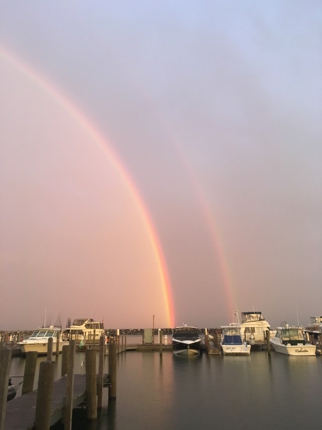 A rainbow between two storms at daybreak; Fishtown, Michigan